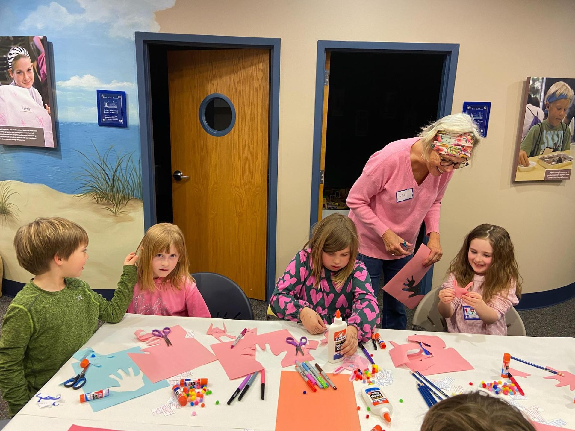 Volunteer helping children