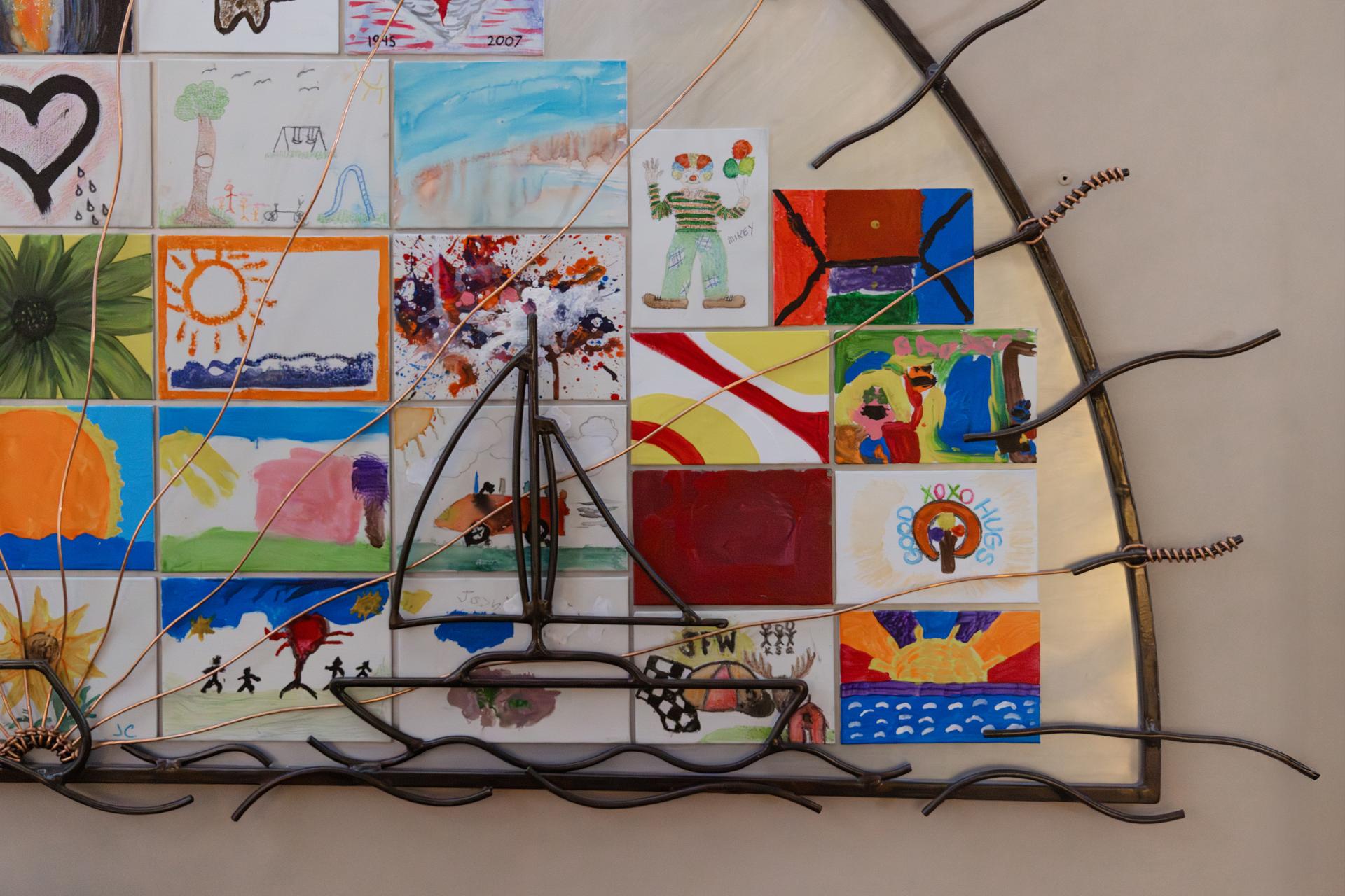 Sailboat with kids drawings behind it